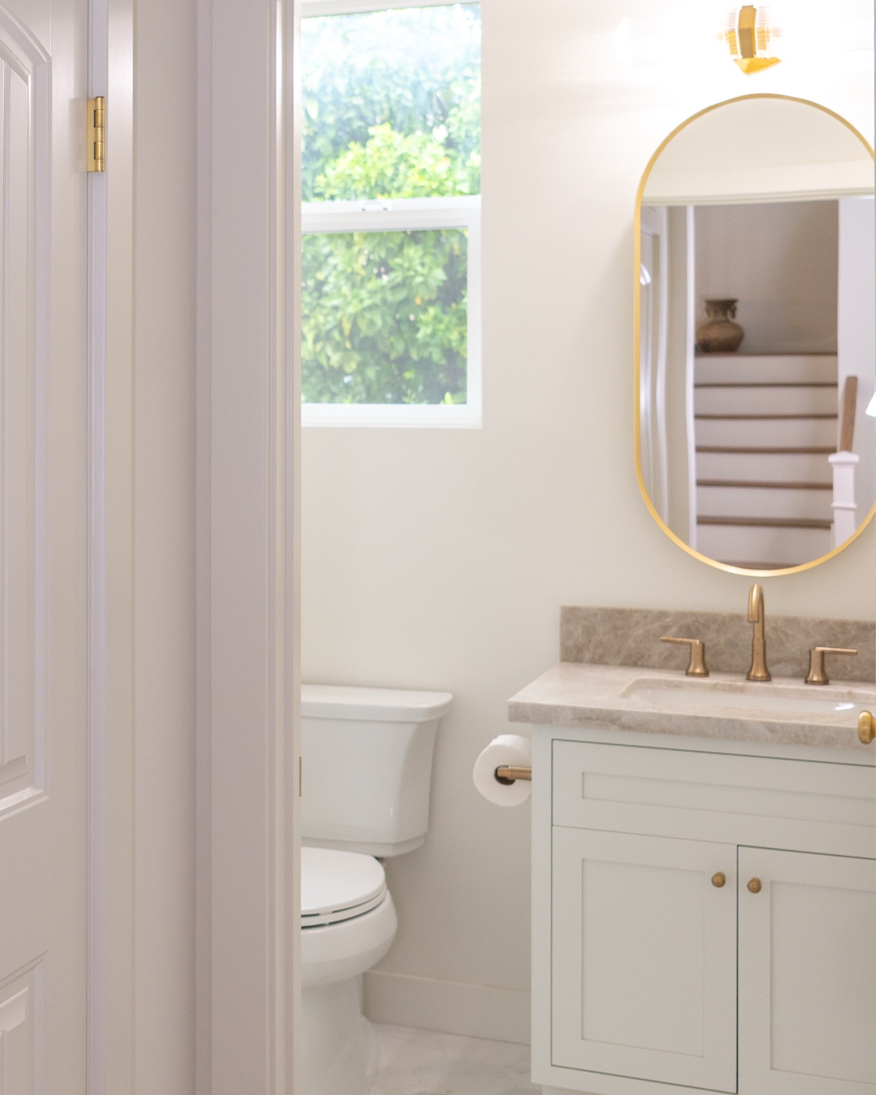 Bathroom vanity and brass fixtures